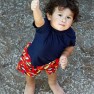 Child gives thumbs up