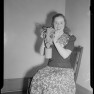 Smiling woman with gas mask