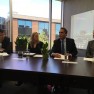 MEC President Chris Kolb, second from right, discusses the impact of proposed budget cuts at a press conference Thursday